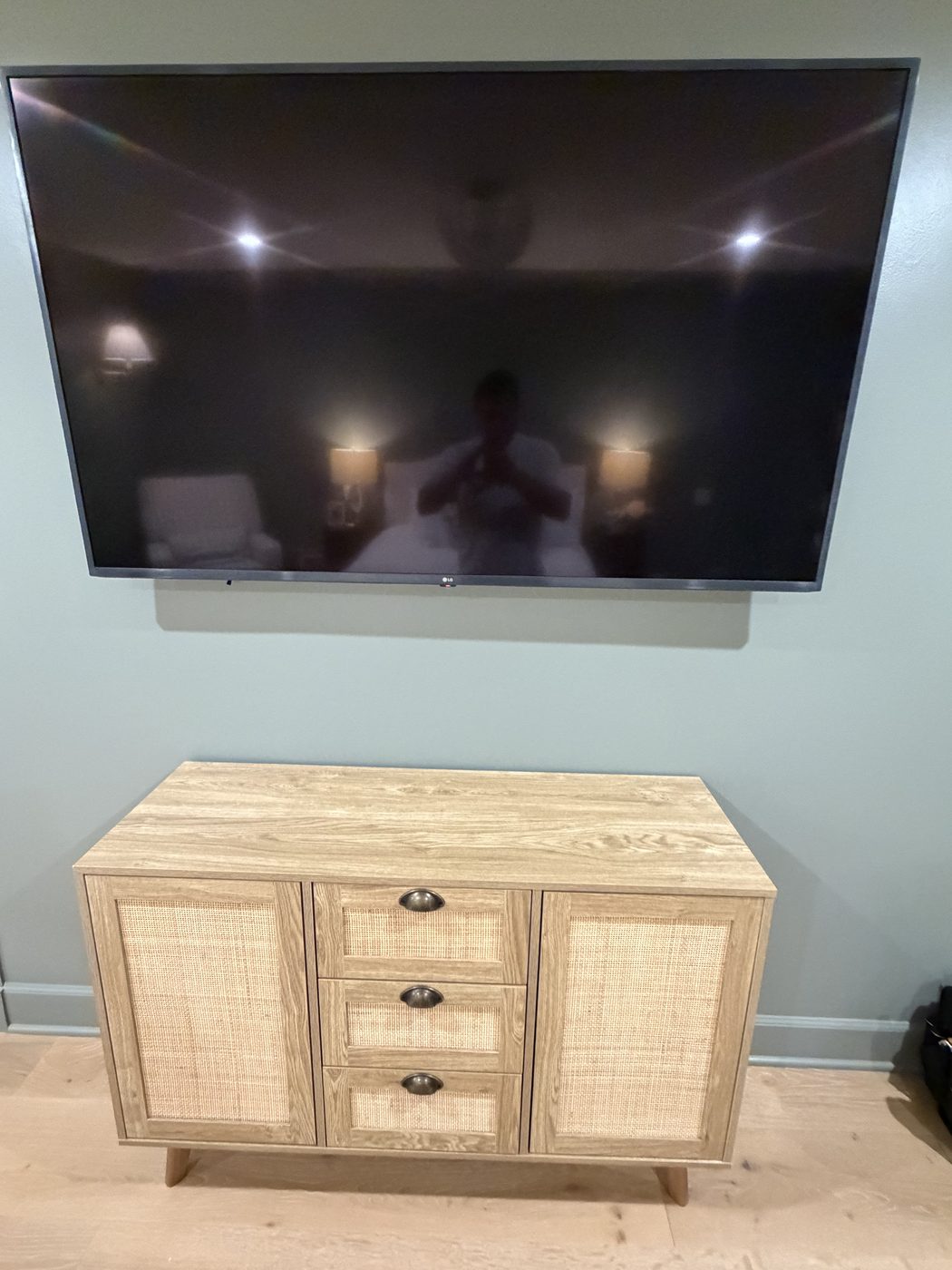 Wall-mounted TV above console